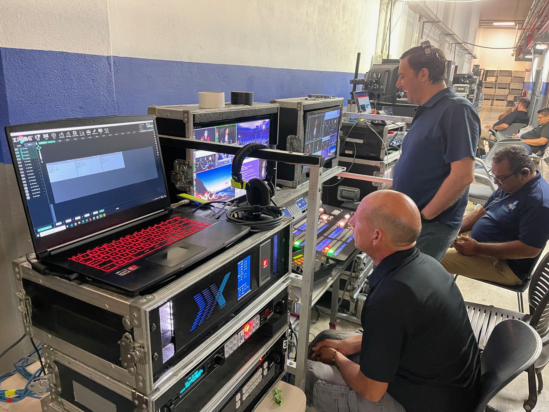 Technicians working at a production desk