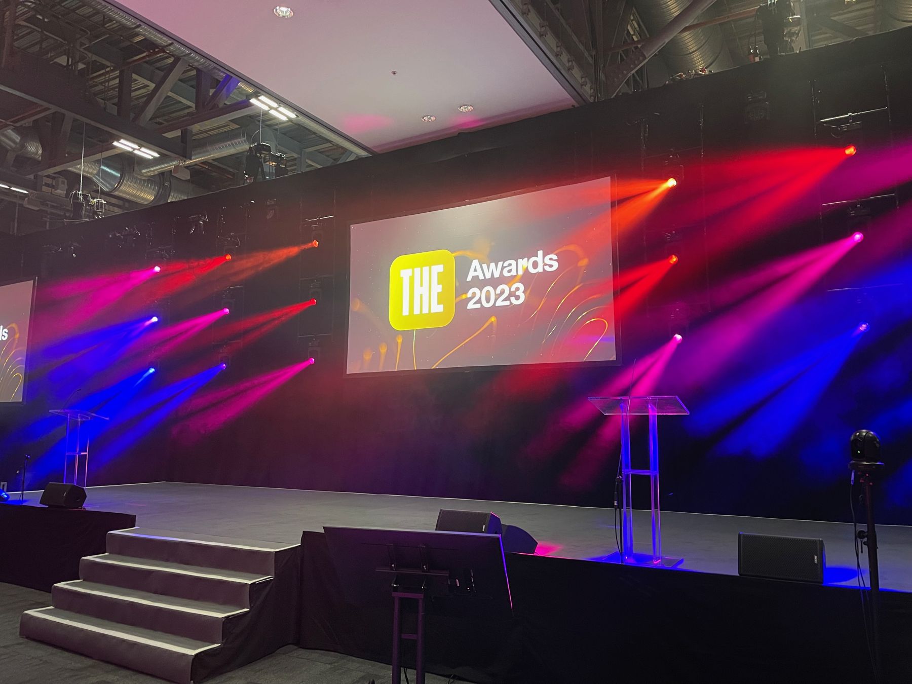 Awards stage with lighting and a large screen